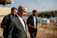Israeli Prime Minister Benjamin Netanyahu attends a briefing near the Salem military post