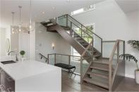 <p>The staircase has a simple, industrial look that compliments the home’s feel. </p>