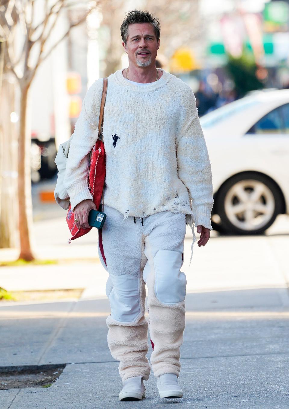 Brad Pitt Continues to Chart His Own Style Course in Tattered Sweater