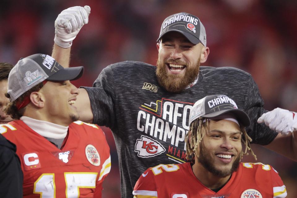 Kansas City Chiefs' Travis Kelce Patrick Mahomes and Tyrann Mathieu celebrate after the NFL AFC Championship football game against the Tennessee Titans Sunday, Jan. 19, 2020, in Kansas City, MO. The Chiefs won 35-24 to advance to Super Bowl 54. (AP Photo/Charlie Riedel)