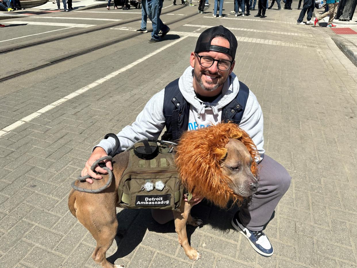 Tom McDevitt and his dog Bobby, known as “Detroit Ambassadog” on Instagram, attending the first day Thursday of NFL draft festivities in downtown Detroit.