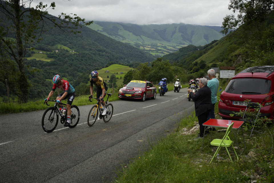 Belgium's Victor Campenaerts, left, and Belgium's Wout Van Aert climbs Soudet pass during the fifth stage of the Tour de France cycling race over 163 kilometers (101 miles) with start in Pau and finish in Laruns, France, Wednesday, July 5, 2023. (AP Photo/Daniel Cole)