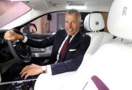 CEO of Rolls-Royce Motor Cars, Torsten Muller-Otvos, poses for a photograph inside the new Rolls-Royce Ghost car at their Goodwood factory near Chichester