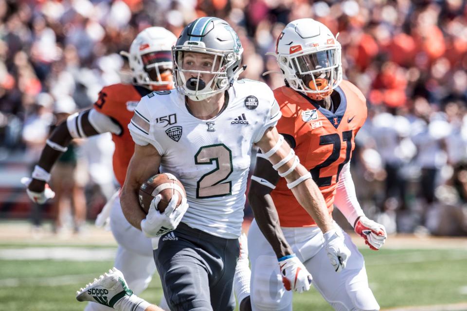 Eastern Michigan's Matthew Sexton heads to the end zone pursued by Illinois's Jartavius Martin in the first half Saturday, Sept.14, 2019, in Champaign, Ill.