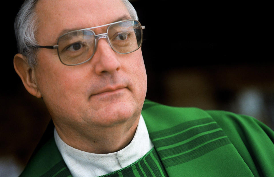 In this Jan. 27, 2001, photo, Father Steven Gerard Stencil poses for a portrait at his church, St. Mark the Evangelist, in Oro Valley, Ariz. Stencil was suspended from ministry in 2001 after a trip to Mexico that violated a diocese policy forbidding clerics from being with minors overnight. In a 2019 Facebook post, the former priest said that he was working as a driver for a private Phoenix bus company that specializes in educational tours for school groups and scout troops. (Ben Kirkby/Arizona Daily Star via AP)