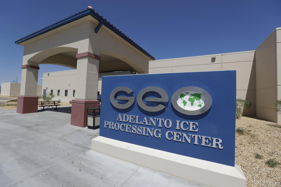 This Wednesday, Aug. 28, 2019, photo shows the Adelanto U.S. Immigration and Enforcement Processing Center operated by GEO Group, Inc. (GEO) a Florida-based company specializing in privatized corrections in Adelanto, Calif. California is banning the use of for-profit, private detention facilities, including those the federal government uses for immigrants awaiting deportation hearings. Gov. Gavin Newsom announced Friday, Oct. 11, 2019 he had signed a measure into law that helps fulfill his promise to end the use of private prisons.(AP Photo/Chris Carlson)