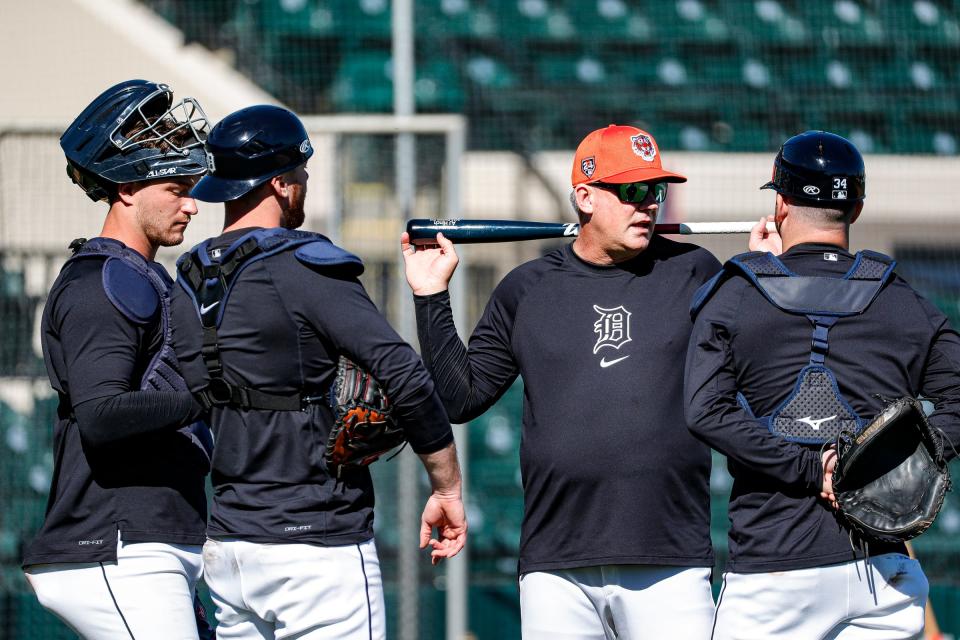 Detroit Tigers manager A.J. Hinch talks to catchers Dillon Dingler, left, Carson Kelly and Jake Rogers during spring training at Joker Marchant Stadium in Lakeland, Florida, on Thursday, Feb. 22, 2024.