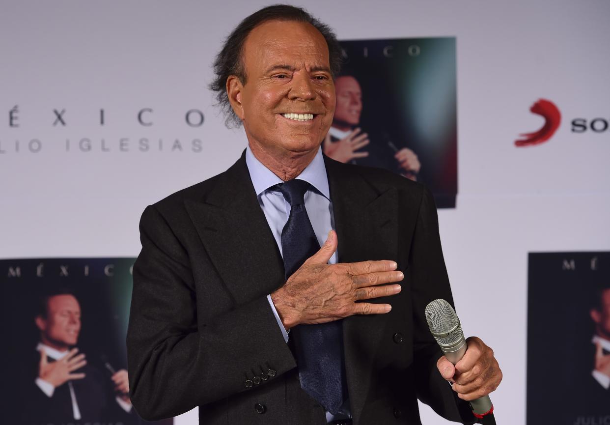 Spanish singer Julio Iglesias gestures before a press conference in Mexico city, on September 23, 2015. Iglesias is in Mexico to promote his new album "Mexico". AFP PHOTO/RONALDO SCHEMIDT        (Photo credit should read RONALDO SCHEMIDT/AFP/Getty Images)