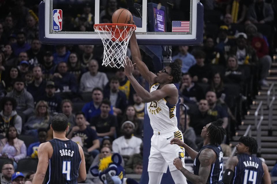 Indiana Pacers' Jalen Smith (25) puts up a shot during the first half of an NBA basketball game against the Orlando Magic, Monday, Nov. 21, 2022, in Indianapolis. AP Photo/Darron Cummings)