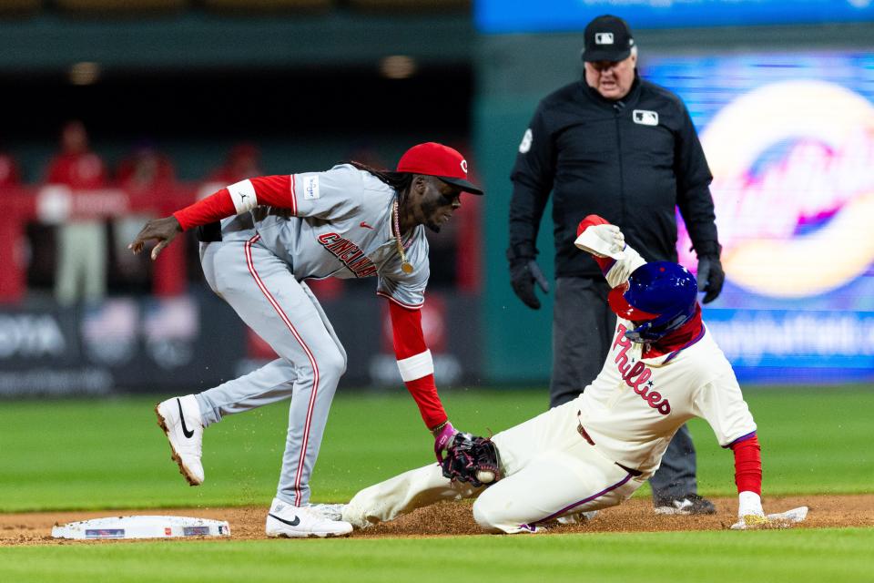 Elly De La Cruz applies a tag on Nick Castellanos in Philadelphia Wednesday night. With De La Cruz's enormous talent come big expectations, writes Gordon Wittenmyer.