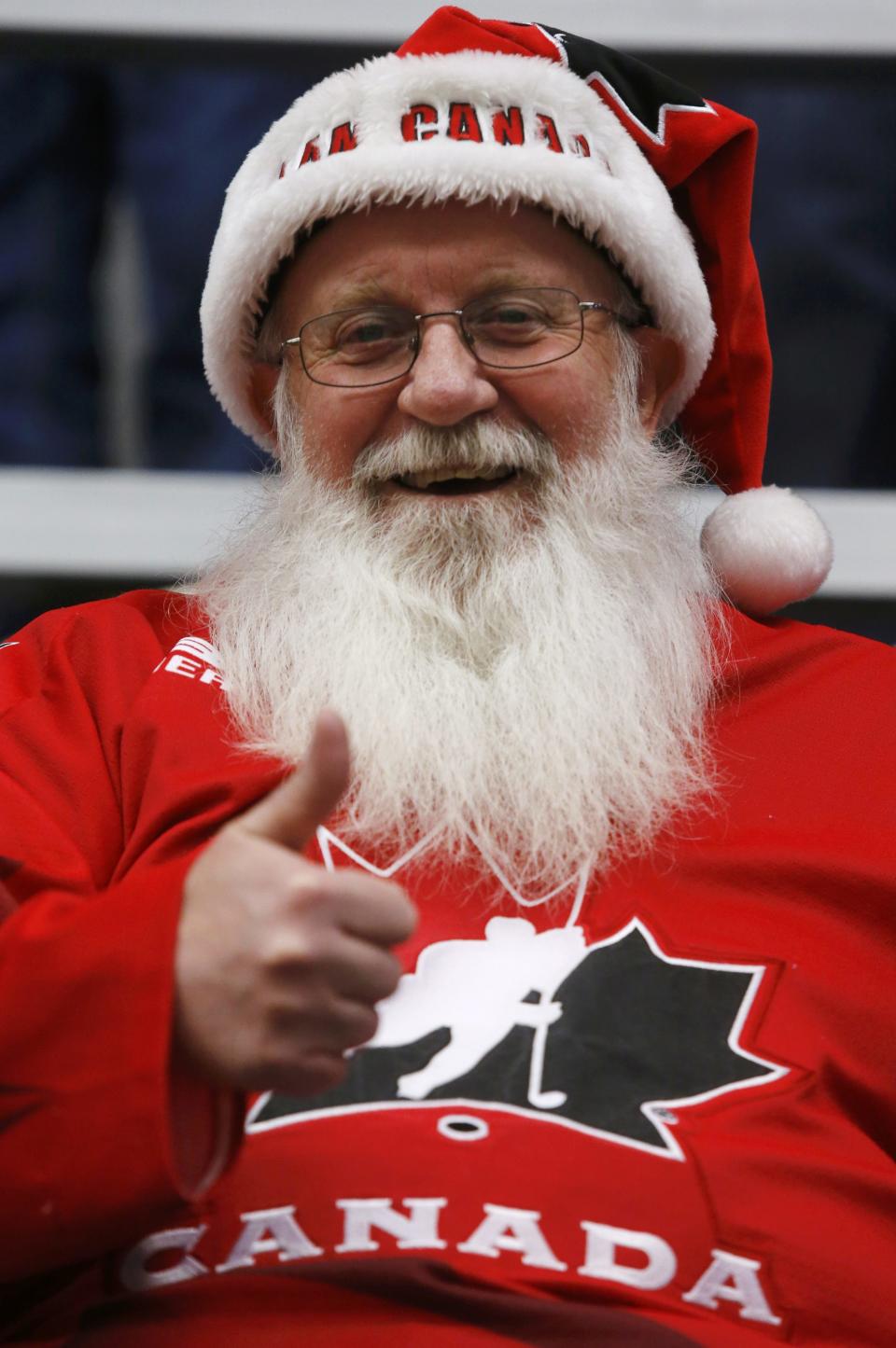 A Canadian supporter cheers before Canada plays United States in their IIHF World Junior Championship ice hockey game in Malmo