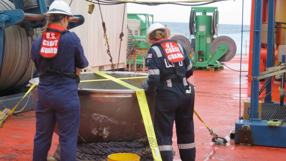 Coast Guard marine safety engineers conduct a survey of the aft titanium endcap from Titan in the North Atlantic Ocean on October 1.
 - Chief Warrant Officer Melissa Le/US Coast Guard/NTSB