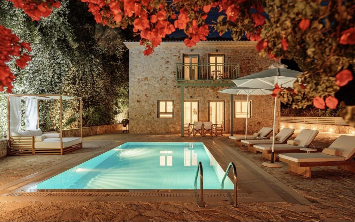 Villa and pool at night