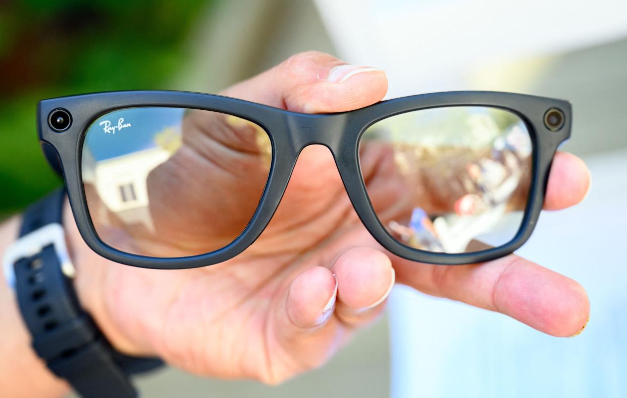 Hand holding a pear of Meta Ray Bans Smart Glasses