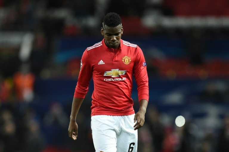 Manchester United's midfielder Paul Pogba leaves the pitch after losing a last 16 second leg UEFA Champions League football match against Sevilla March 13, 2018