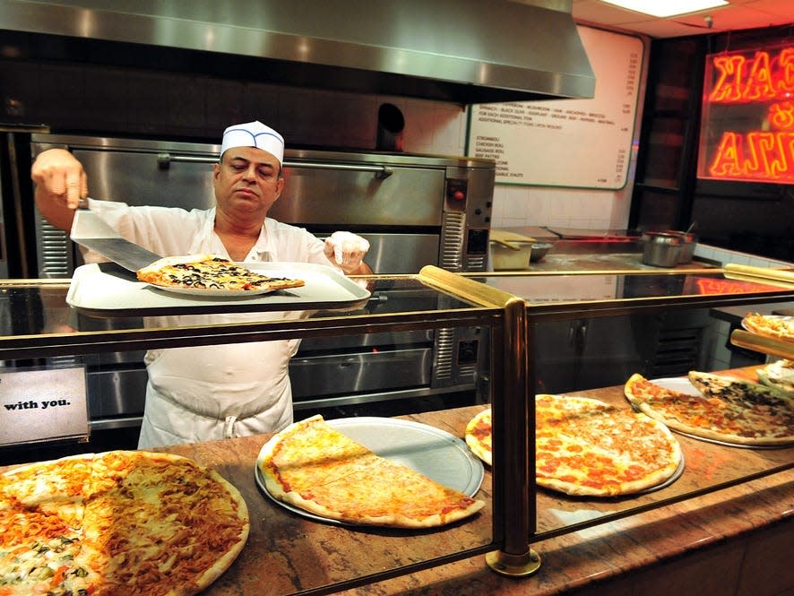 New york pizza being served in a restaurant