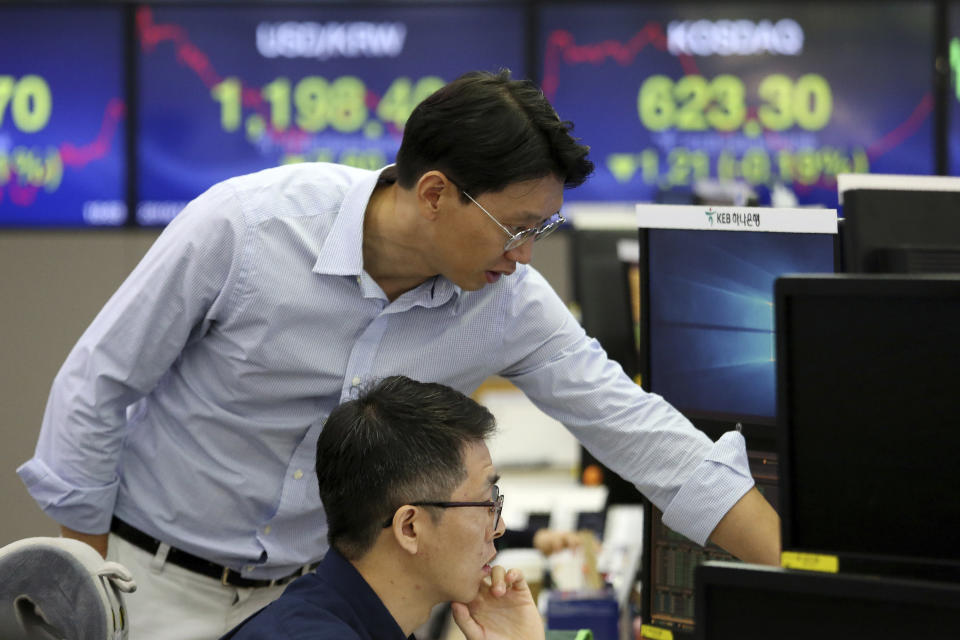 Currency traders watch monitors at the foreign exchange dealing room of the KEB Hana Bank headquarters in Seoul, South Korea, Friday, Oct. 4, 2019. Asian stocks were mixed Friday after Wall Street rebounded on investor hopes for a U.S. interest rate cut. (AP Photo/Ahn Young-joon)