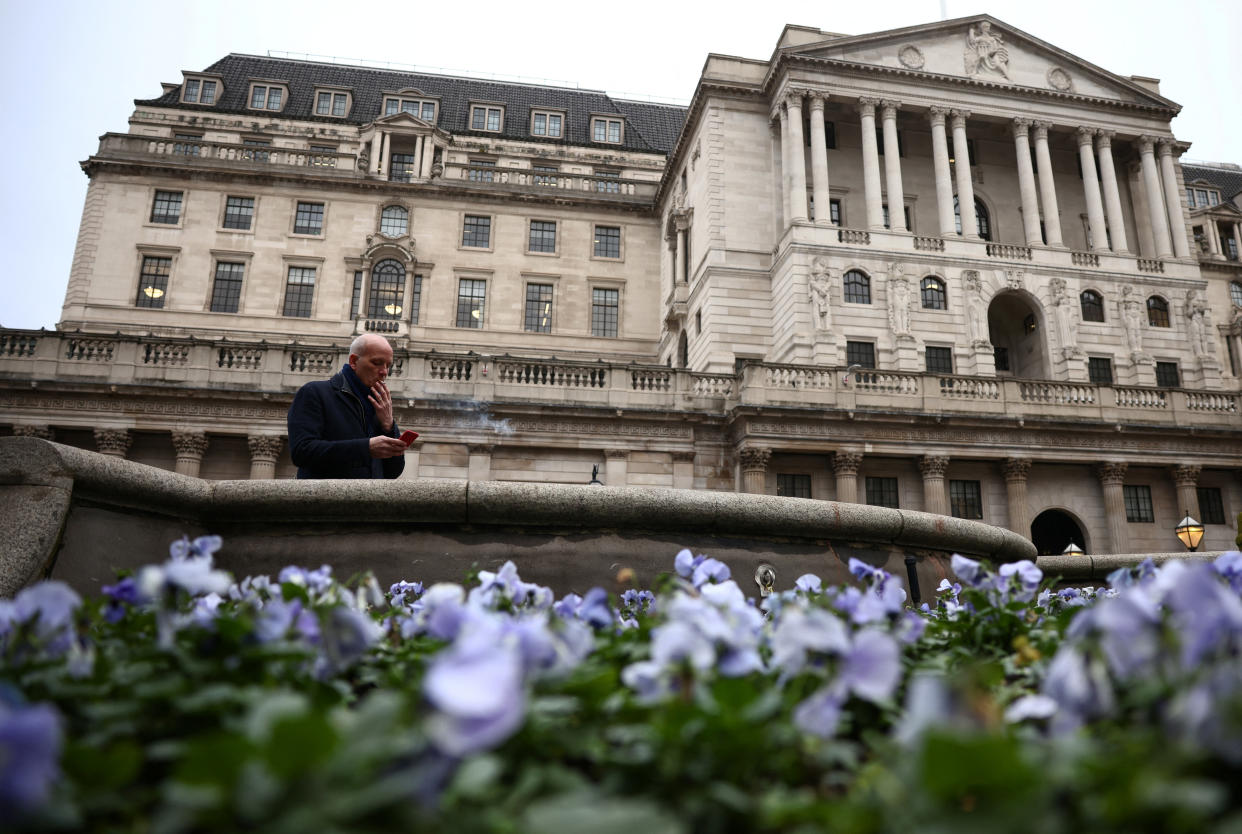 Bank of England  A person smokes a cigarette outside the Bank of England in the City of London financial district, in London, Britain, January 26, 2023. REUTERS/Henry Nicholls