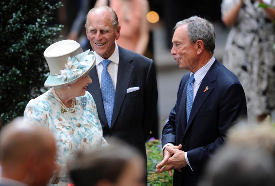 Queen Elizabeth II, left, and Prince Phillip, center, speak to New York City Mayor Michael Bloomberg during her visit to the British Garden at Hanover Square in New York, Tuesday, July 6, 2010.