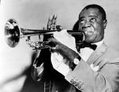 <p>While he’s probably best known for having one of the most distinctive voice in music, Louis Armstrong was also one of the best trumpeters of all time. He was expressionistic and skilled beyond belief, influencing jazz music to move from group improvisation to solo performances. Armstrong was active for nearly 60 years, and is considered to be one of the first black musicians whose popularity <a href="http://www.npr.org/templates/story/story.php?storyId=6524506" rel="nofollow noopener" target="_blank" data-ylk="slk:transcended the;elm:context_link;itc:0;sec:content-canvas" class="link ">transcended the </a>racial divisions that gripped the earlier half of the 20th century. He also had an incredibly dapper style, typically sporting a bow tie and pocket square when he performed. <i>(Photo: Getty Images)</i></p>