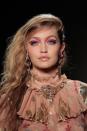 <p>Hair stylist Garren resurrected the aughts of ‘80s nightlife with hair that was piled to one side of the head, yielding spunky volume at Sui's <a rel="nofollow noopener" href="https://www.crfashionbook.com/beauty/g16867290/beauty-looks-from-fallwinter-2018/?slide=2" target="_blank" data-ylk="slk:Fall 2018 show;elm:context_link;itc:0;sec:content-canvas" class="link ">Fall 2018 show</a>. Workable with a range of hair types, from straight to curly, the tactfully lopsided proportion of this hairstyle is more attainable than it may seem.</p>