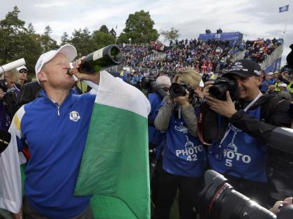 Europe&#39;s Jamie Donaldson drinks from a champagne bottle to celebrate his singles match to win the 2014 Ryder Cup golf tournament at Gleneagles, Scotland, Sunday, Sept. 28, 2014. (AP Photo/Matt Dunham)