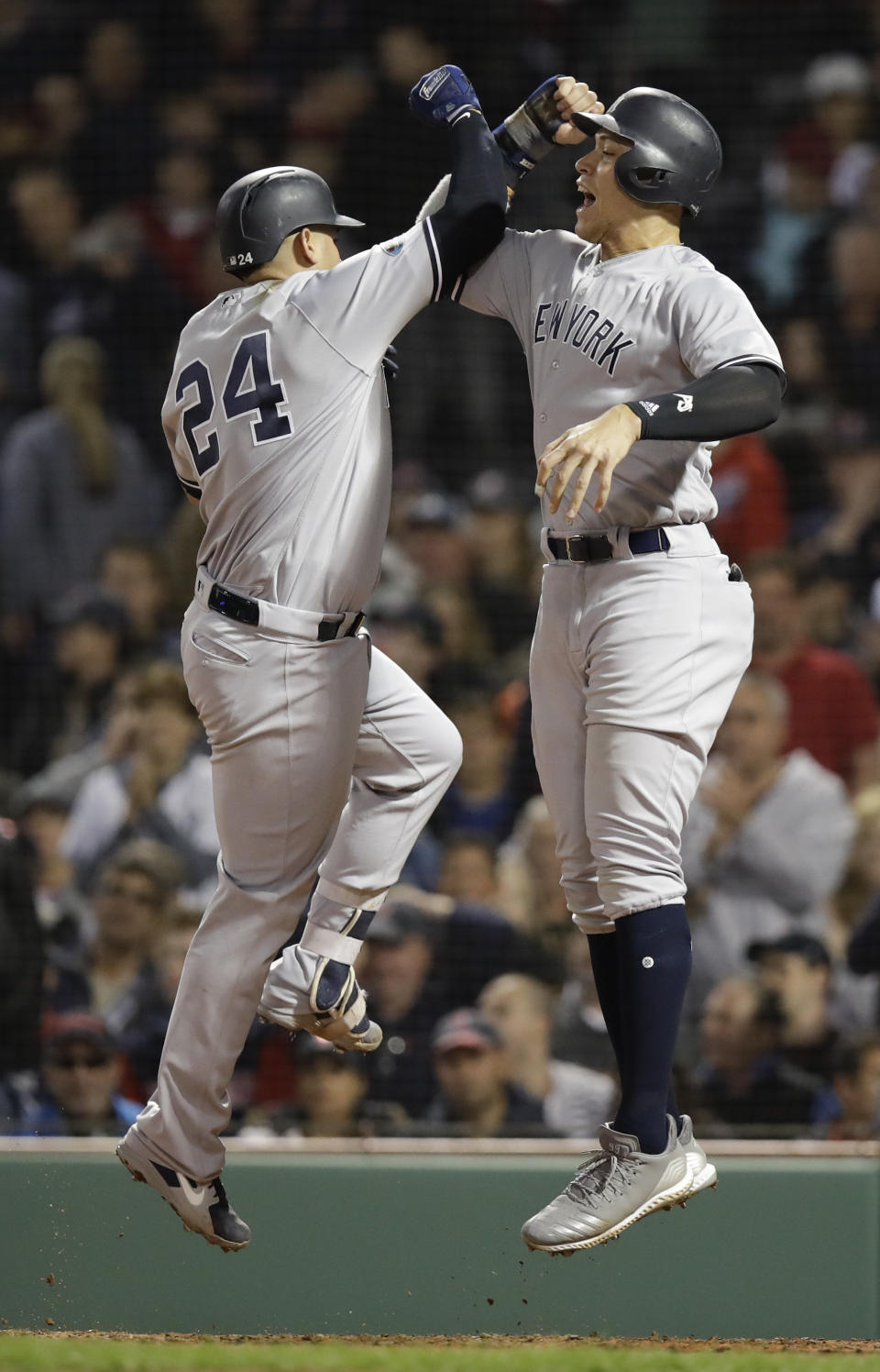 New York Yankees' Gary Sanchez, left, celebrates after his three-run home run with Aaron Judge against the Boston Red Sox during the seventh inning of Game 2 of a baseball American League Division Series, Saturday, Oct. 6, 2018, in Boston. (AP Photo/Charles Krupa)