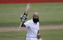 South Africa's Hashim Amla raises his bat as he celebrates his hundred century during the fourth cricket test match against England at Centurion, South Africa, January 22, 2016. REUTERS/Siphiwe Sibeko