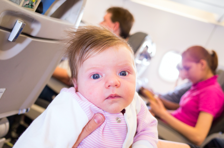 Travelling with one baby, let alone two, can be a challenge (This picture and main picture posed by models: Rex)