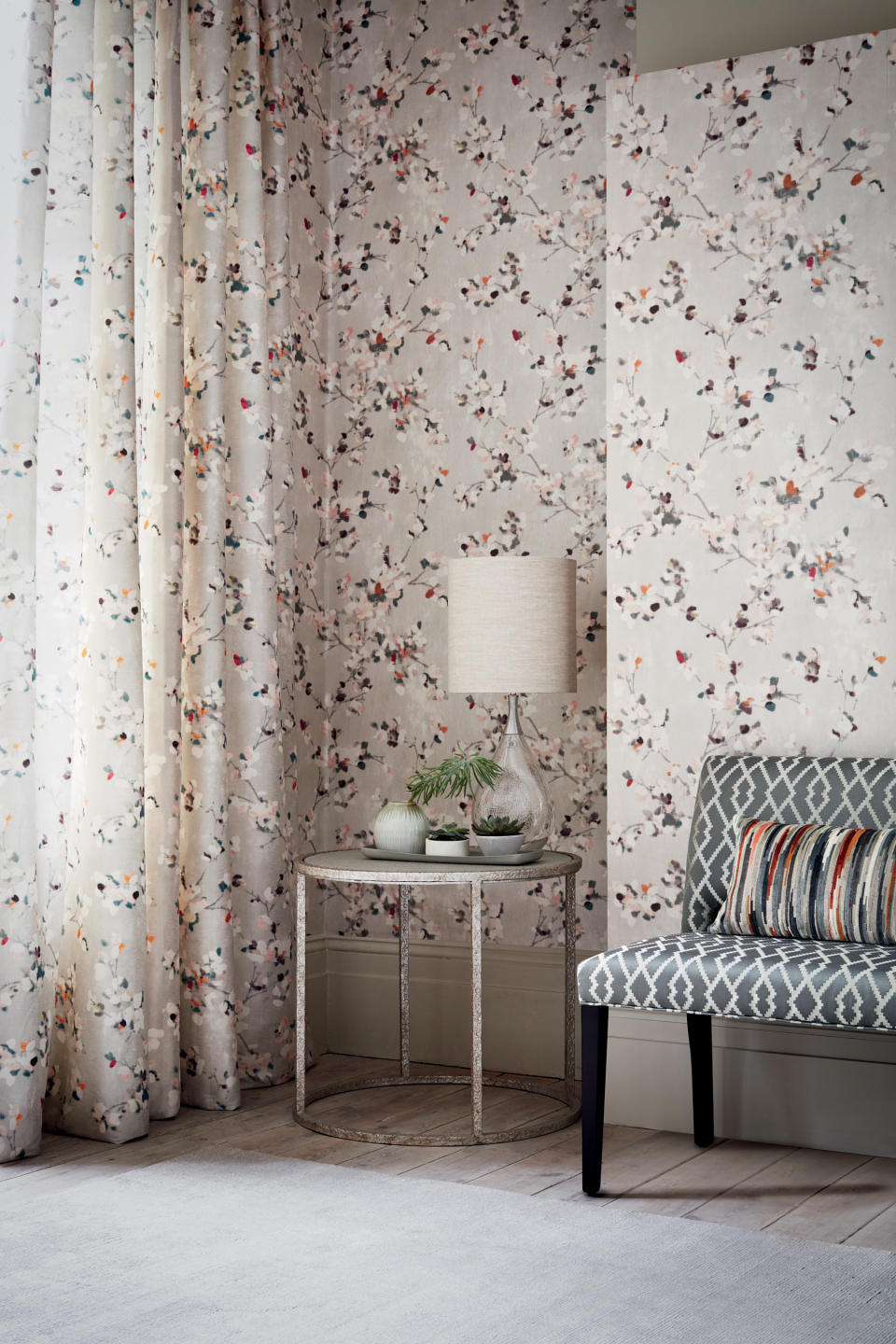 <p> As with every color, there are different tones of grey to choose from. This very pretty Floris wallpaper in Spring Rose from Romo has a warm grey background which is fitting for the Japanese style blossoming branches that appear hand-painted. It has a pearlescent finish which adds a gentle sheen to the surface which reflects the light. </p>