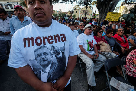 A man wears a T-shirt with a picture of Mexican politician Andres Manuel Lopez Obrador, leader of the National Regeneration Movement (MORENA) party during a meeting at Plaza Olivera in Los Angeles, California, U.S., February 12, 2017. REUTERS/Ringo Chiu