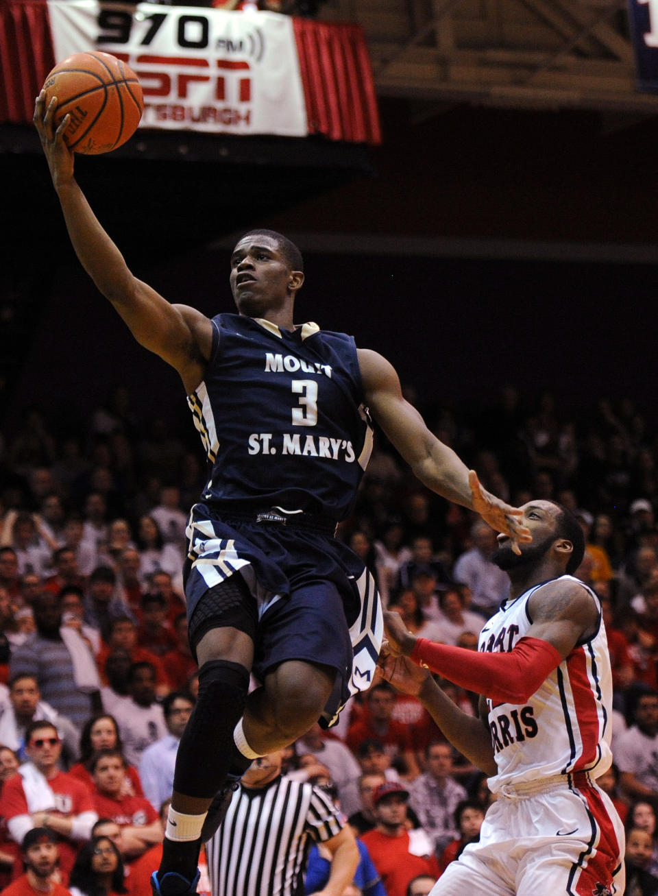 Mount St. Mary's' Sam Prescott (3) drives for a lay up against Robert Morris' Lucky Jones during the first half of the Northeastern Conference championship NCAA college basketball game on Tuesday, March 11, 2014, in Coraopolis, Pa. (AP Photo/Don Wright)
