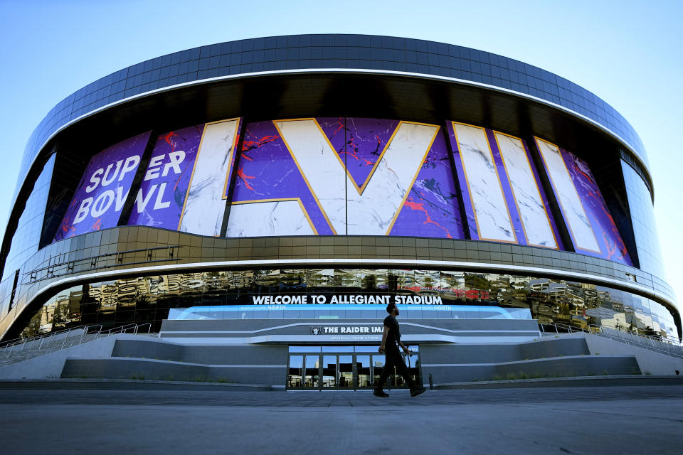 A worker walks in front of Allegiant Stadium in advance of Super Bowl 58, Tuesday, Jan. 30, 2024, in Las Vegas. (AP Photo/Matt York)