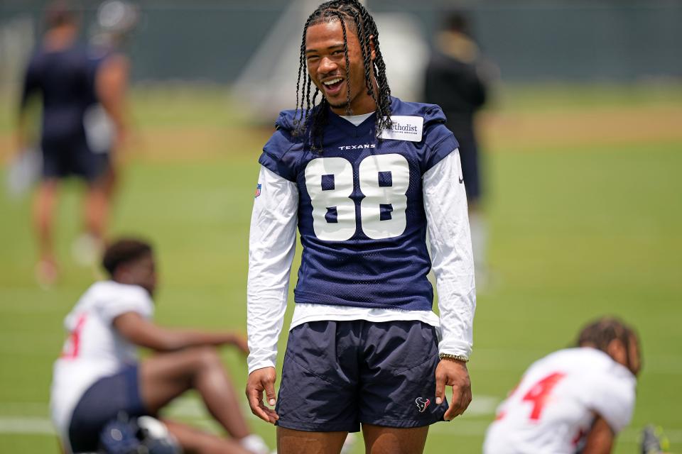 FILE - Houston Texans' John Metchie III smiles during an NFL football rookie minicamp practice on May 13, 2022, in Houston. The rookie wide receiver announced Sunday, July 24, 2022, that he has been diagnosed with a form of leukemia. (AP Photo/David J. Phillip, File)