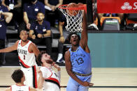 Memphis Grizzlies' Jaren Jackson Jr. dunks the ball during the second half of an NBA basketball game against the Memphis Grizzlies against the Portland Trail Blazers, Friday, July 31, 2020, in Lake Buena Vista, Fla. (Mike Ehrmann/Pool Photo via AP)