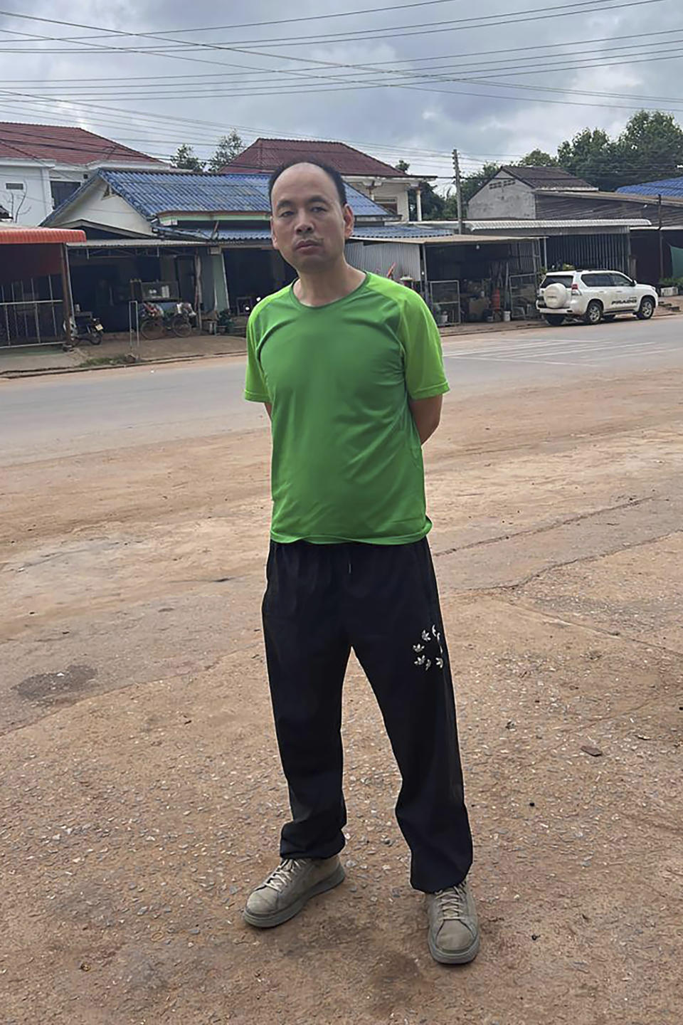 This UGC photo made available by a source wishing to remain anonymous shows Chinese rights lawyer Lu Siwei on a road, at an undisclosed location, around 300 kilometers (186 miles), north of Vientiane, Laos, Thursday, July 27, 2023, as he headed south to the border with Thailand. Lu, stripped of his license for taking on sensitive cases, has been arrested in the Southeast Asian country of Laos, with activists and family members worried he will be deported back to China where he could face prison time.(Anonymous Source via AP)