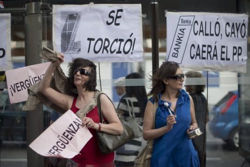 People demonstrate against banking abuses on June 02, in Madrid. Eurozone finance ministers eyed an up to 100-billion-euro ($125 billion) strings-attached rescue of Spain's distressed banks at emergency talks