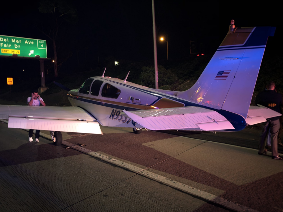 Light aircraft flies through underpass to make emergency landing on US motorway