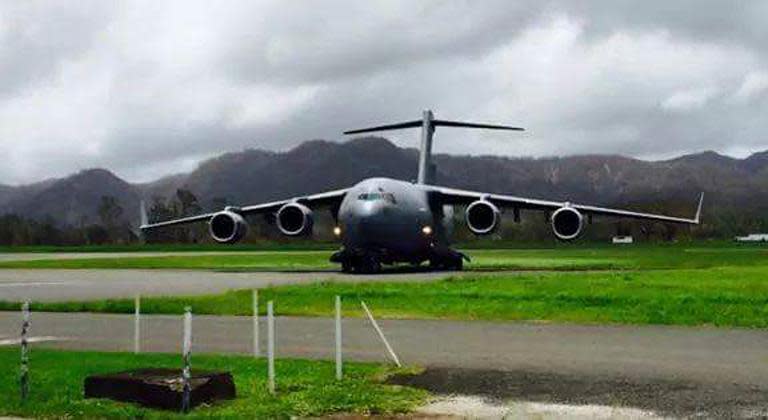 A cargo plane lands at the airport with relief aid, in the Vanuatu capital of Port Vila, on March 15, 2015