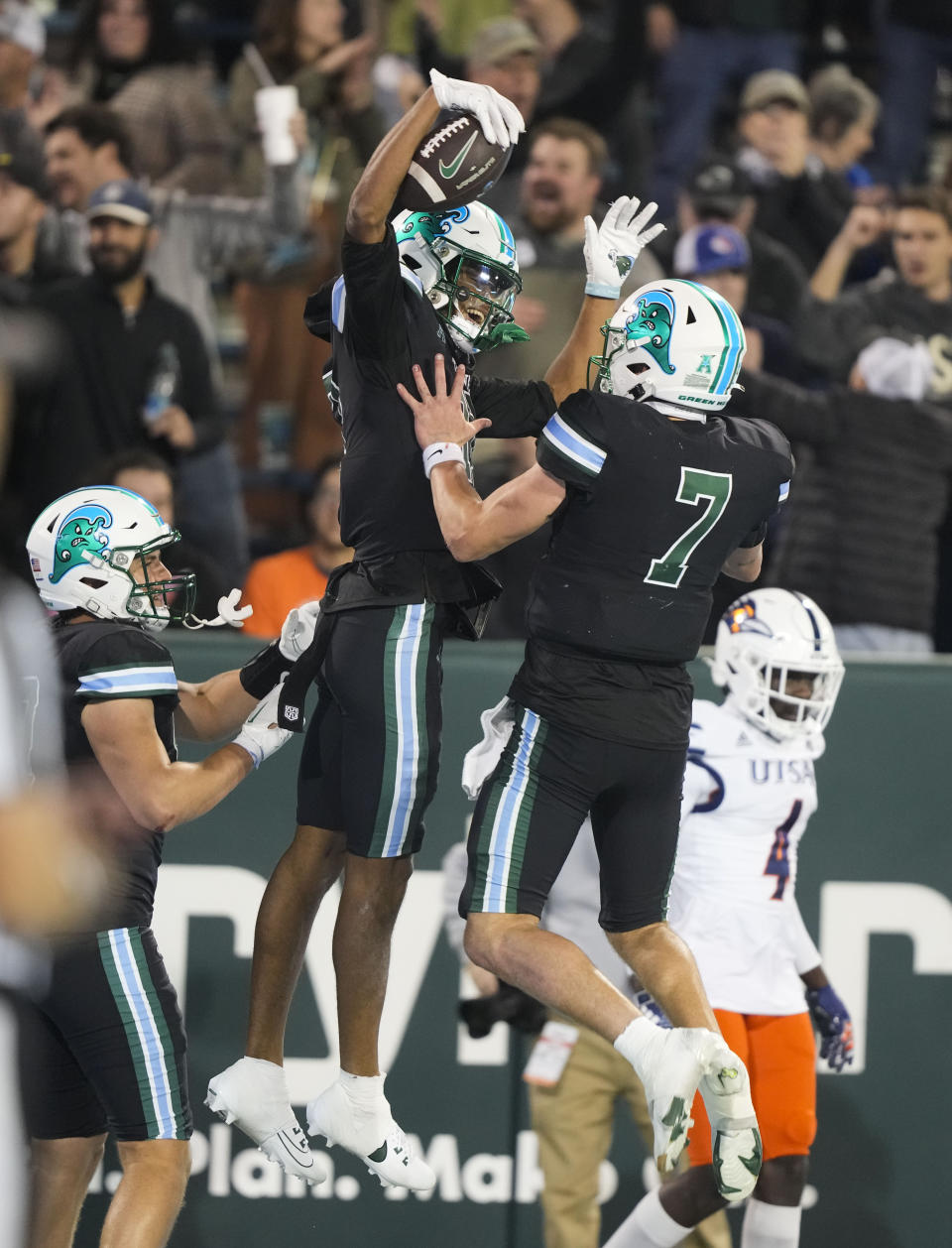 Tulane wide receiver Chris Brazzell II celebrates his touchdown reception with quarterback Michael Pratt (7) in the second half of an NCAA college football game against UTSA in New Orleans, Friday, Nov. 24, 2023. Tulane won 29-16. (AP Photo/Gerald Herbert)