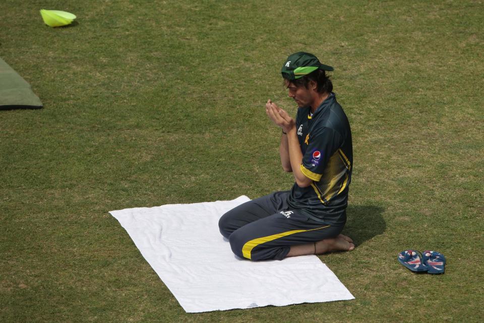 Pakistan’s Anwar Ali prays on the ground during a practice session ahead of the Asia Cup tournament in Dhaka, Bangladesh, Monday, Feb. 24, 2014. Pakistan plays Sri Lanka in the opening match of the five nation one day cricket event that begins Tuesday. (AP Photo/A.M. Ahad)