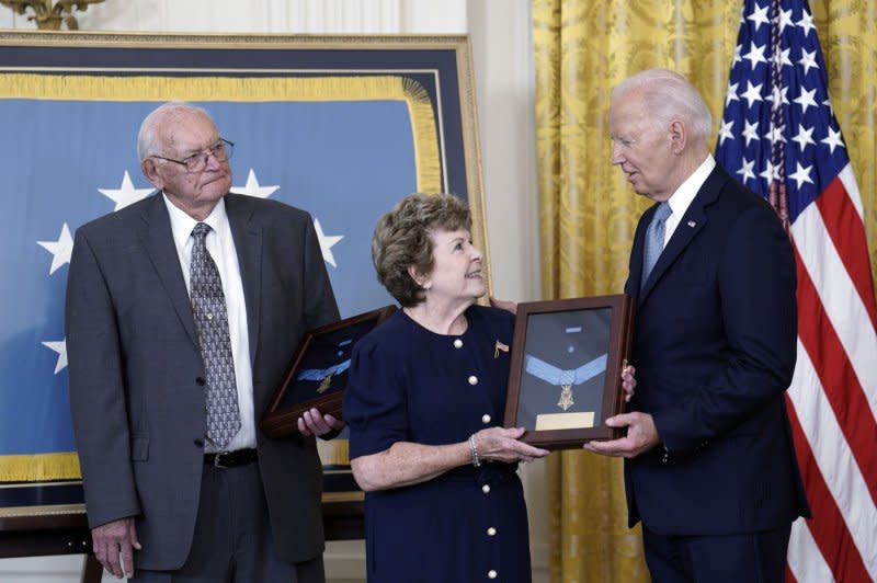 President Joe Biden (R) presents the Medal of Honor to Theresa Chandler (C) and Gerald Taylor (L), descendants of Civil War Union soldiers Pvt. Philip Shadrach and Pvt. George Wilson during a ceremony in the East Room of the White House in Washington, D.C. on Wednesday. Photo by Yuri Gripas/UPI