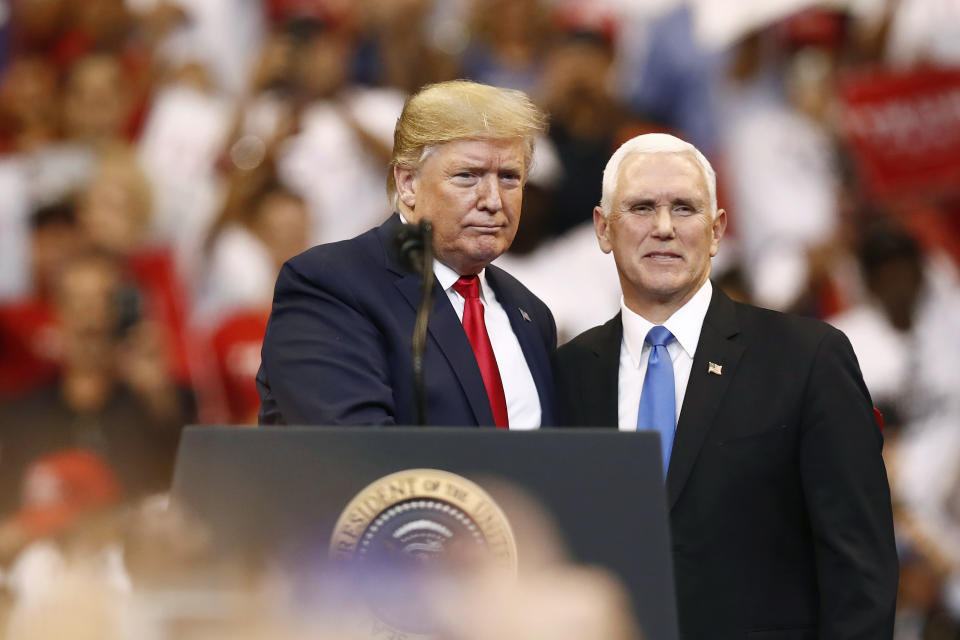 President Donald Trump and Vice President Mike Pence stand together during a campaign rally on Tuesday, Nov. 26, 2019, in Sunrise, Fla. (AP Photo/Brynn Anderson)