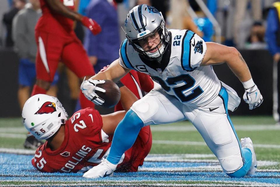 Carolina Panthers running back Christian McCaffrey (22) scores a touchdown over Arizona Cardinals linebacker Zaven Collins (25) during a game at Bank of America Stadium in Charlotte, N.C., Sunday, Oct. 2, 2022.