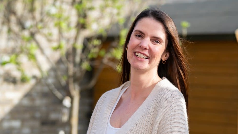 Leyla Eaton, lottery winner, smiling at the camera