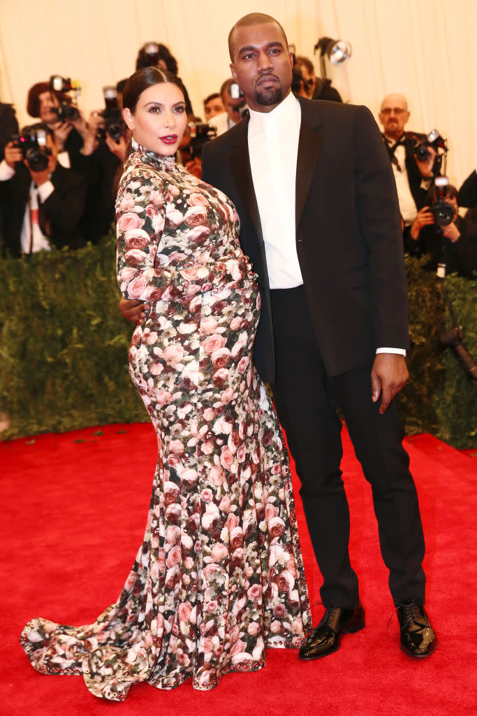 Kim Kardashian and Kanye West at the 2013 Met Gala, Punk: Chaos to Couture, couch dress, Givenchy, red carpet
