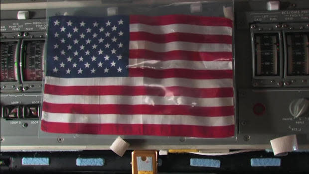 Nine years ago, an American flag was brought to the International Space Station aboard the last space shuttle flight.   / Credit: CBS News