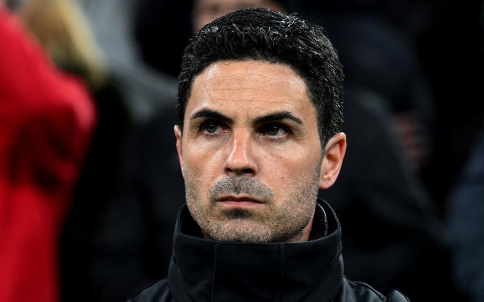 Arsenal manager Mikel Arteta standing before their match against Bayern Munich