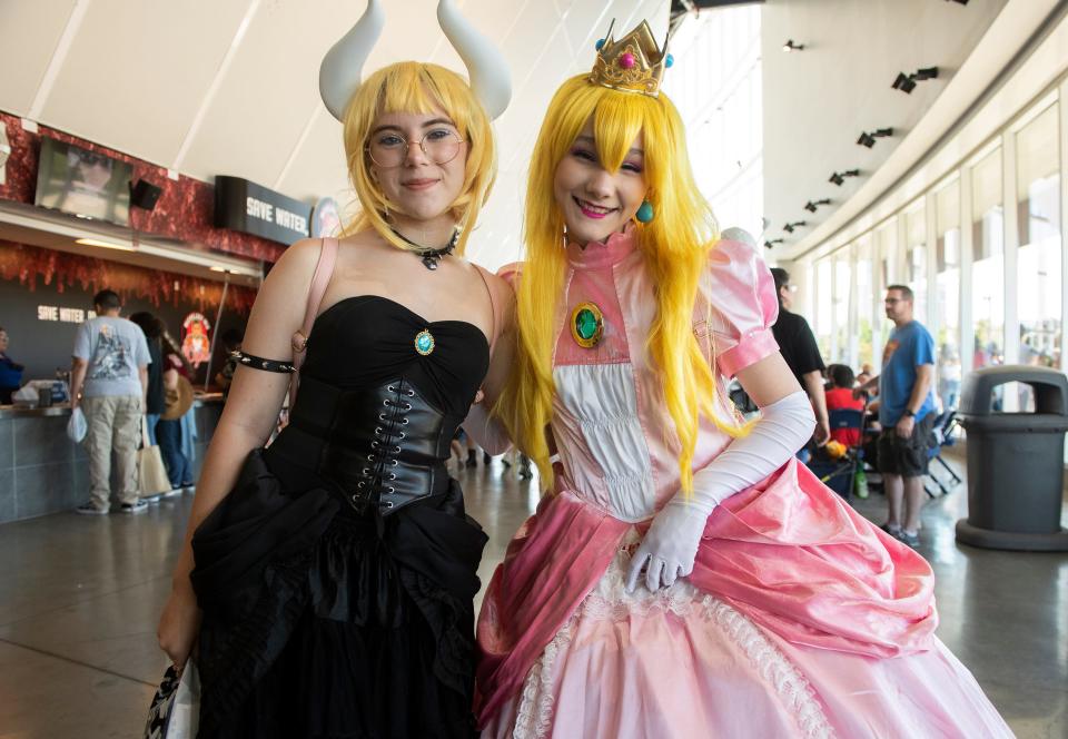 Leia Miller, left and Peyton Toon, both from Tracy, dressed as Nintendo characters Bowsette and Princess Peach at the annual StocktonCon at the Stockton Arena in downtown Stockton on Saturday, August, 13, 2022.  