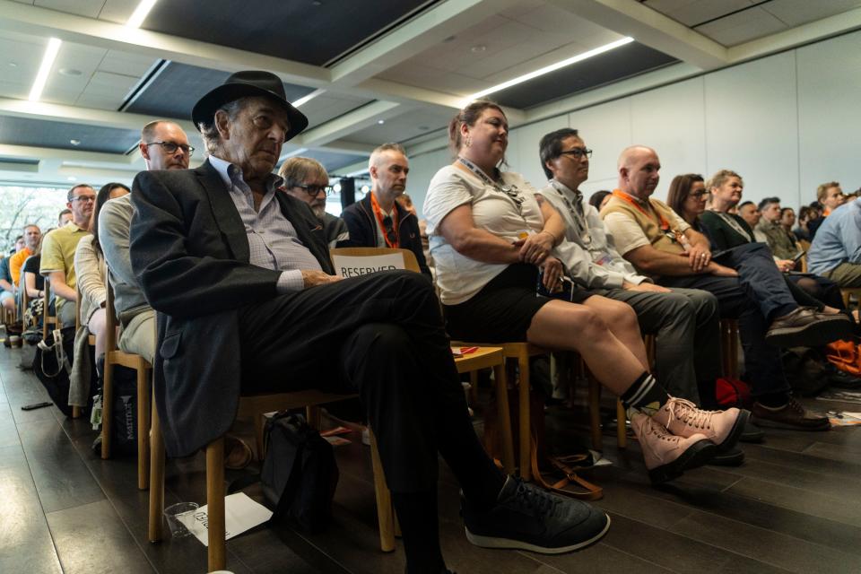 Paul Pelosi, left, listens as his wife, Nancy, talks politics at South by Southwest. He was attacked with a hammer by an intruder at their San Francisco home in October.